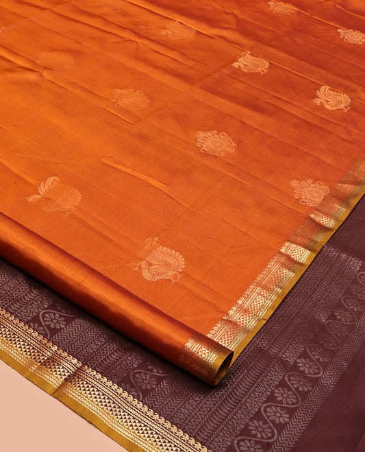 Orange Mayuri Soft Silk Saree, Accentuated with Zari Buttas All Over Its Body, Highlighted by Zari Border of Manga Mokku, and Ara Maadam Designs, and Paired with a Contrast Geometric Patterned Pallu and Paired with a Contrast Blouse