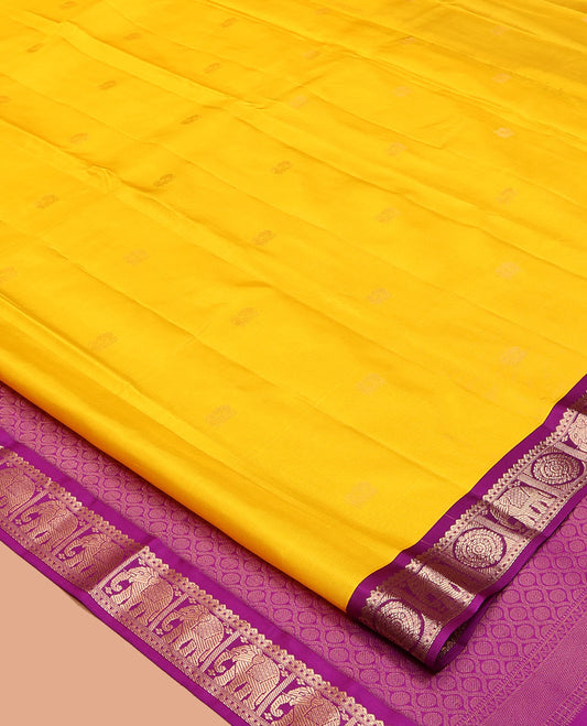 Yellow Vasundhara Silk Saree, Subtly Sparkled with Zari Buttas, Complemented by Contrast Border of Rekku, Chakram, and Yaanai Designs, Jaal Pallu, and a Contrast Blouse