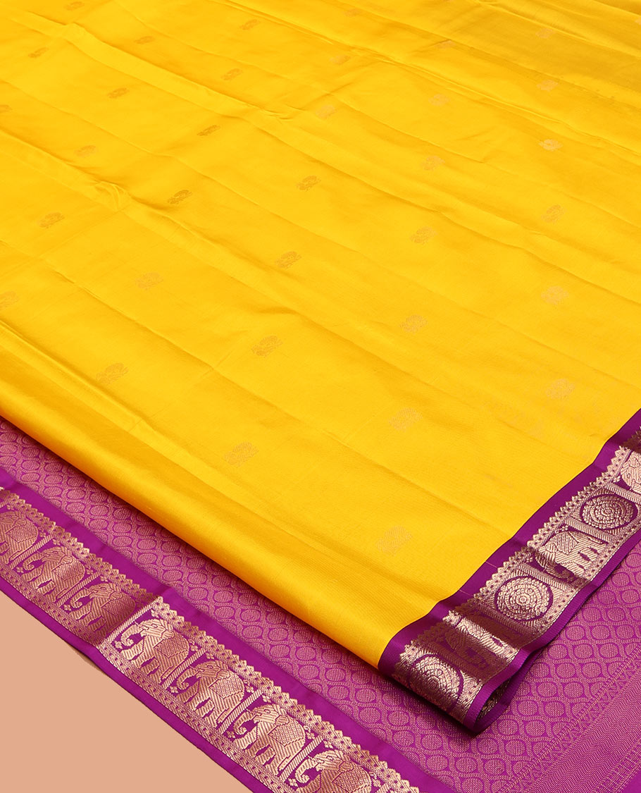 Yellow Vasundhara Silk Saree, Subtly Sparkled with Zari Buttas, Complemented by Contrast Border of Rekku, Chakram, and Yaanai Designs, Jaal Pallu, and a Contrast Blouse