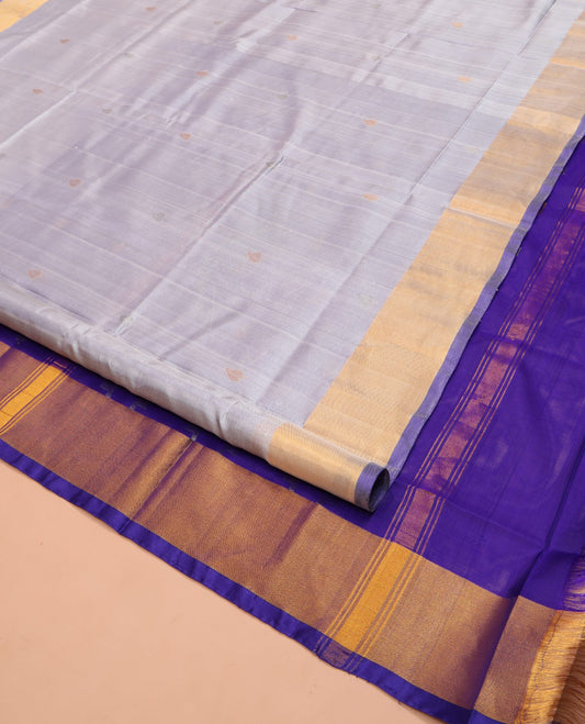 Grey Uppada Silk Saree, Sparsely Woven with Buttas All Over Its Body, Subtle Bavanji Border, Complemented by Contrast Pallu of Butta Enclosed Jaal Designs, and Paired with a Contrast Blouse