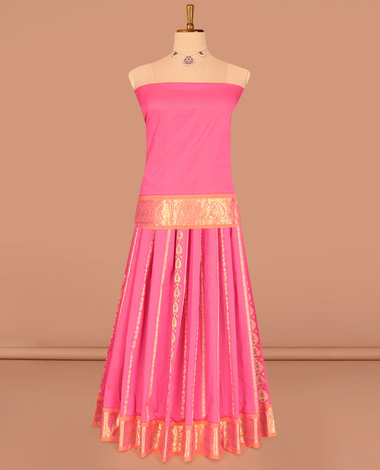 Pink Art Silk Pavadai Material Set, Richly Detailed with Zari Designs on Its Skirt, Complemented by a Contrast Traditional Zari Border, and a Matching Blouse