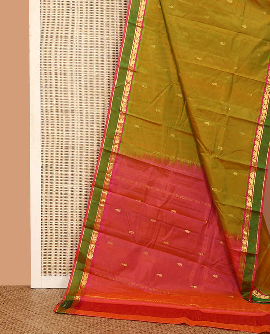 Green striped and buttas Kanchipuram silk saree, contrast rettai pettu border of manga and kathir designs, and zari design pallu