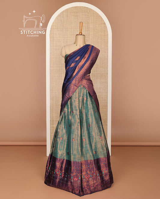 Green floral buttas half saree with contrast intricate zari design border, zari design blouse & floral zari design dhavavni