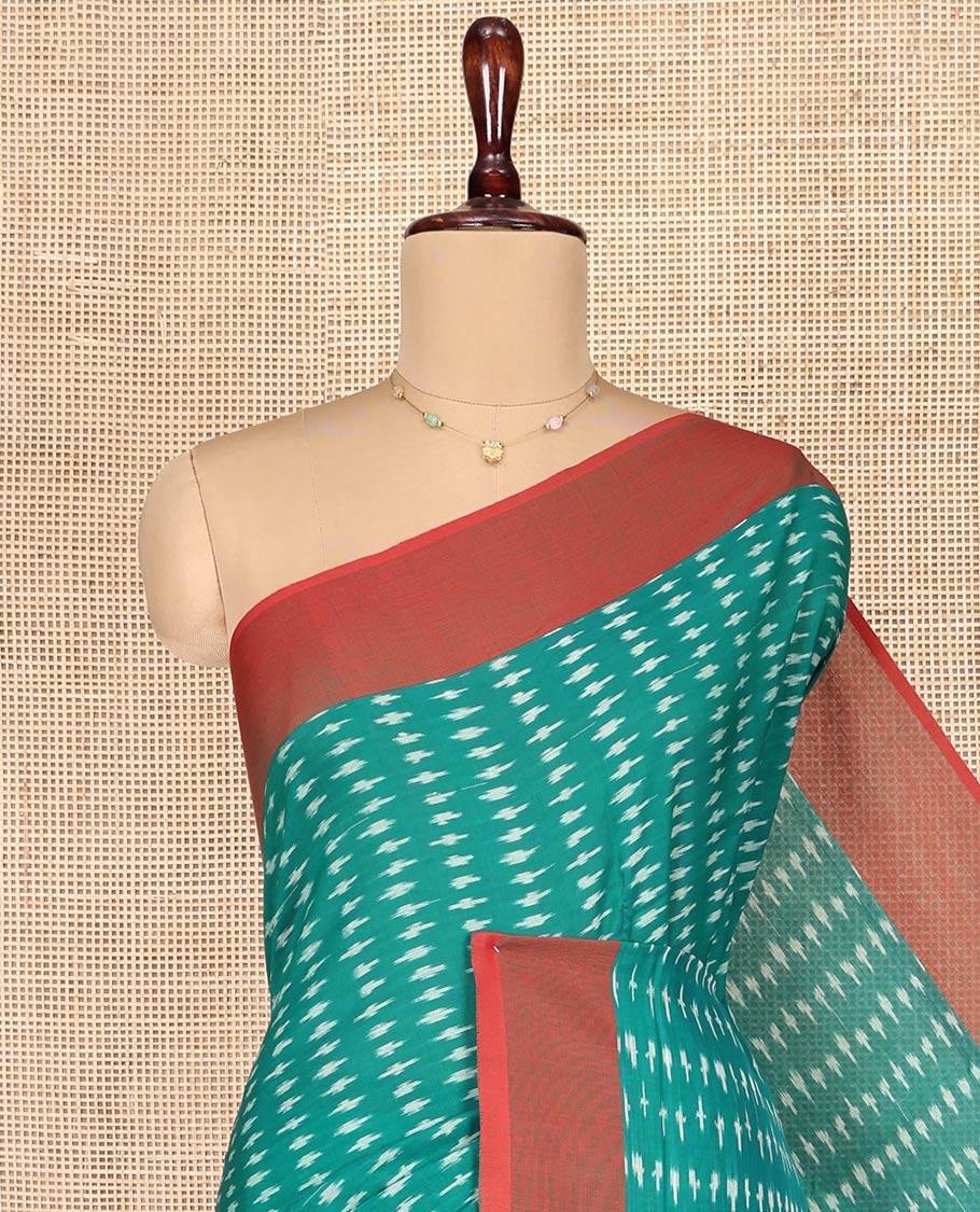 Green Ikkat Cotton Saree, Steeped with Ikkat-Style Buttas on Its Body, Complemented by a Contrast Border, Pallu Steeped with Ikkat-Style Buttas, and Has No Blouse