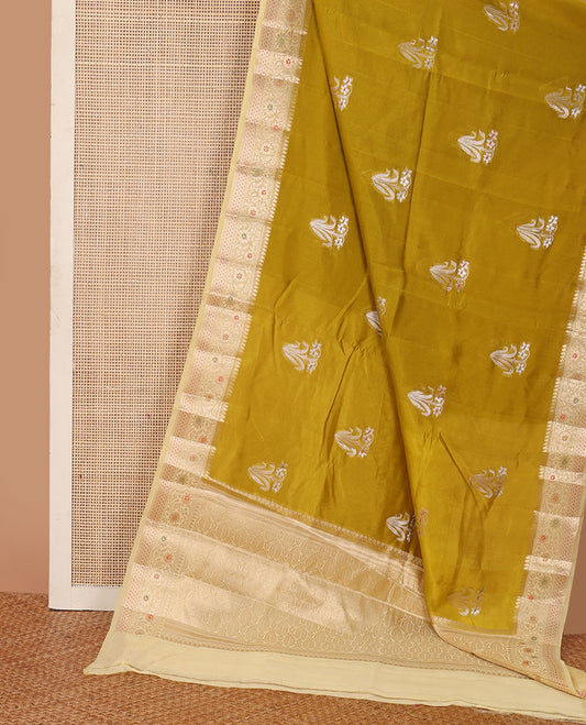 Green floral buttas raw mango silk saree, contrast traditional zari design border, and intricate pallu