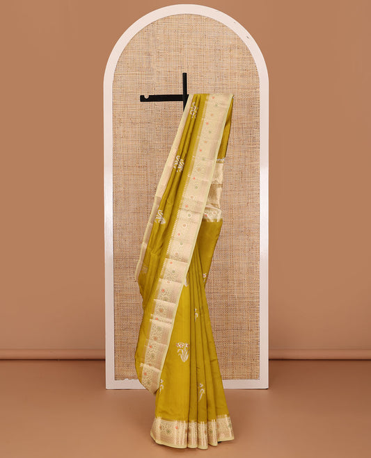 Green floral buttas raw mango silk saree, contrast traditional zari design border, and intricate pallu