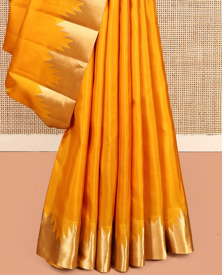 Yellow Plain Kanchipuram Silk Saree, Highlighted by a Zari Thazampoo Rekku Border, Diagonally Striped Pallu, and a Matching Blouse