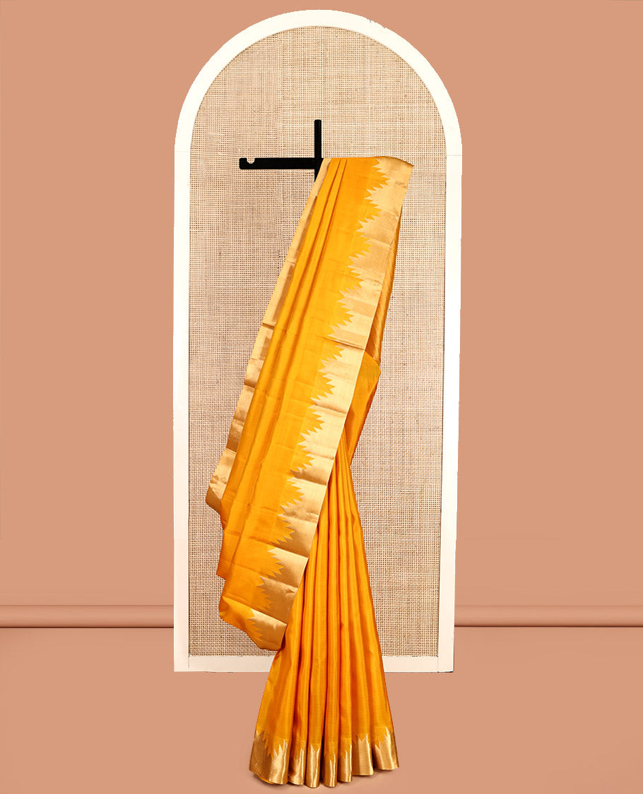 Yellow Plain Kanchipuram Silk Saree, Highlighted by a Zari Thazampoo Rekku Border, Diagonally Striped Pallu, and a Matching Blouse