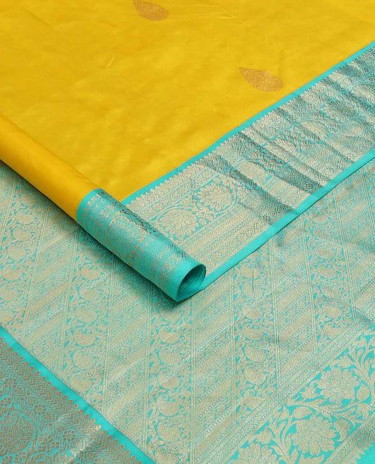 Yellow zari buttas silk saree, contrast border of jadai nagam, and mayil kann, and pallu of diagonally woven kodi manga and geometric designs