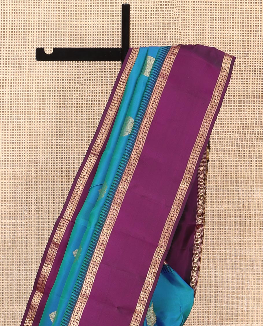 Blue Vasundhara Silk Saree, Delicately Woven with Zari Buttas All Over Its Body, Complemented by a Contrast Rettai Pettu Temple Border of Banaras, and Manga Designs, Grand Jaal Pallu, and Paired with a Contrast Blouse