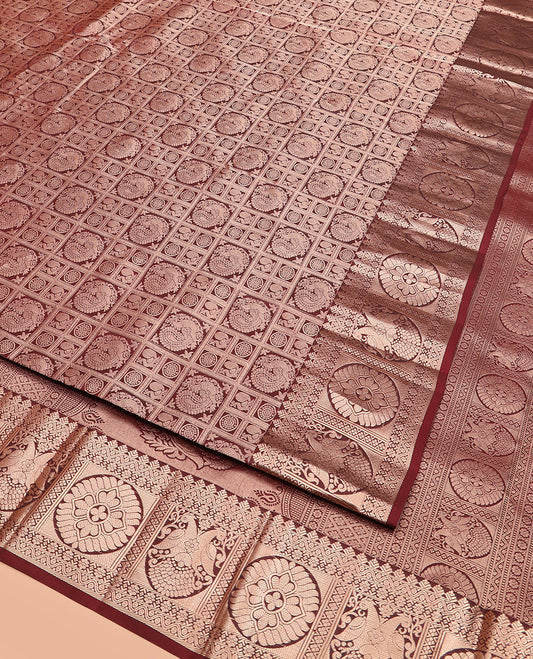 Maroon Kanchipuram Wedding Silk Saree Traditionally Decked Up with Annam Chakram Jacquard Design, Complemented by Zari Border of Chakram and Iruthalai Pakshi Designs, Artfully Detailed Pallu, and Paired with a Matching Blouse