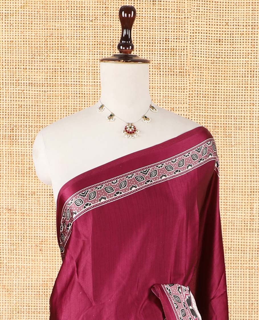 Wine color half-&-half style modal satin saree features floral & geometric design Ajrakh printed contrast border & pallu