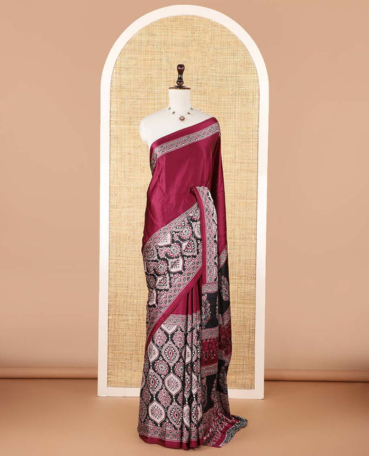 Wine color half-&-half style modal satin saree features floral & geometric design Ajrakh printed contrast border & pallu