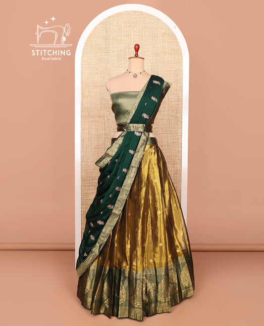 Gold-green zari buttas half-saree with contrast Mughal-style thilak motifs woven bordered skirt, brocade blouse, and a zari design dhavani