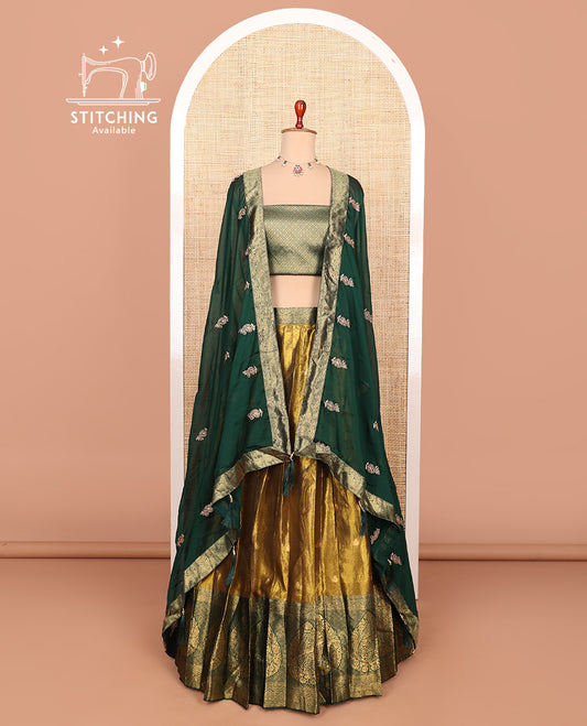 Gold-green zari buttas half-saree with contrast Mughal-style thilak motifs woven bordered skirt, brocade blouse, and a zari design dhavani