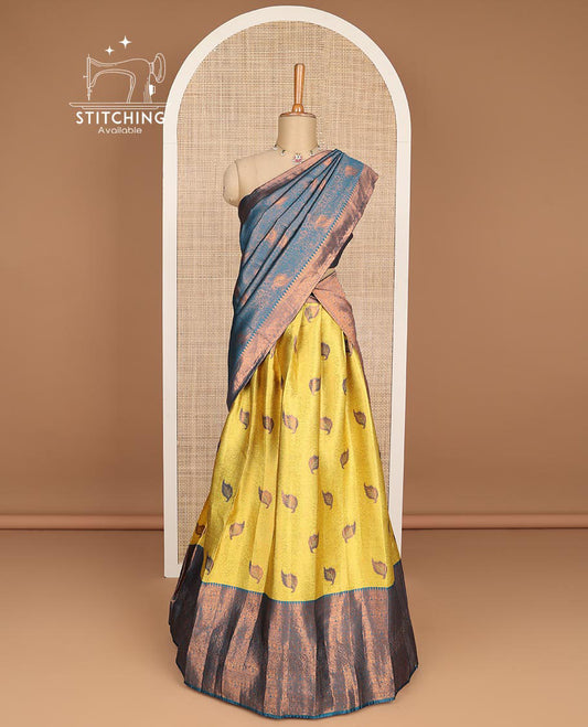 Mustard floral jacquard tissue half saree with contrast zari design border, zari design blouse & floral zari design dhavani