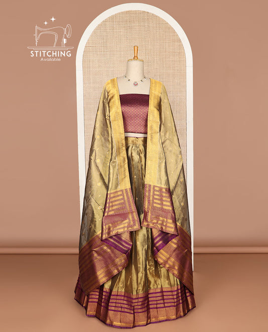 Brown buttas tissue half saree with contrast zari design border, zari design blouse & floral design dhavani