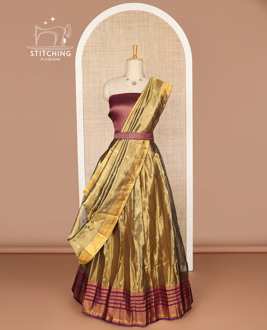 Brown buttas tissue half saree with contrast zari design border, zari design blouse & floral design dhavani