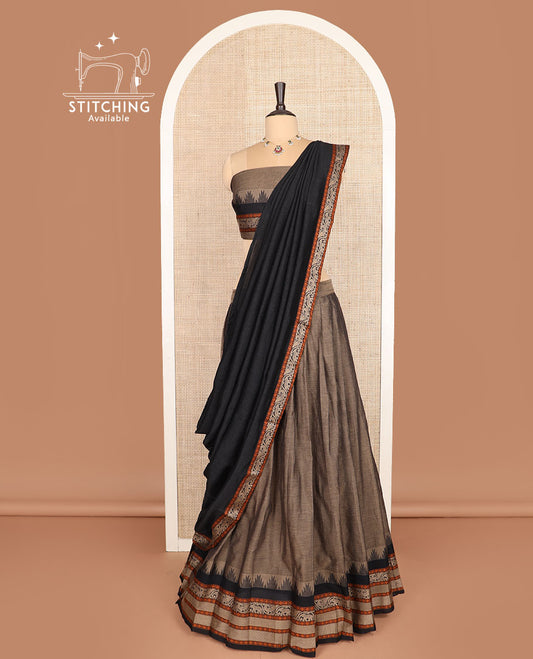 Brown cotton half-saree, plain with contrast traditional motifs woven bordered skirt, matching blouse, and a contrast bordered dhavani