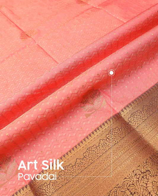 Peach art silk pavadai material, embossed with zari buttas woven skirt, contrast traditional zari border, and blouse
