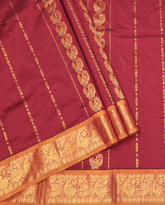 Maroon Art Silk Pavadai Material Set, Adorned with Zari Designs on Its Skirt, Complemented by a Contrast Traditional Zari Border, and a Matching Blouse