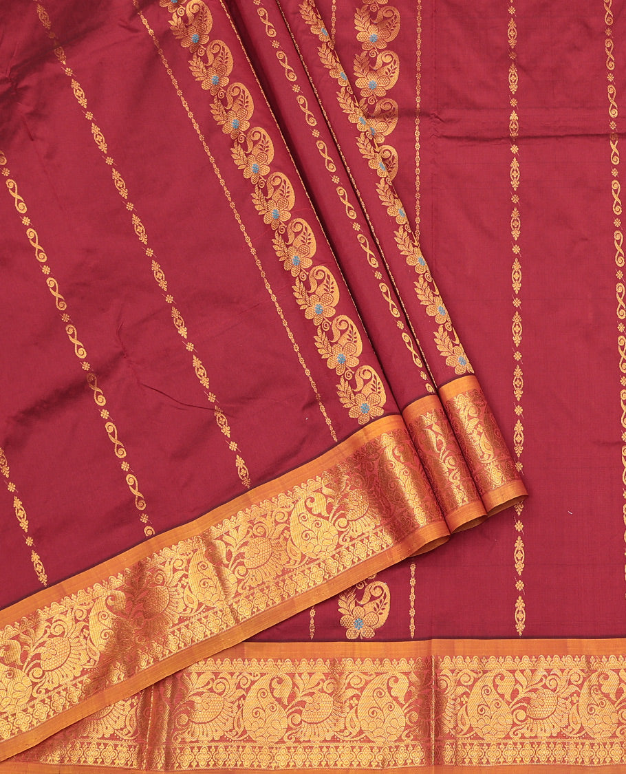 Maroon Art Silk Pavadai Material Set, Adorned with Zari Designs on Its Skirt, Complemented by a Contrast Traditional Zari Border, and a Matching Blouse