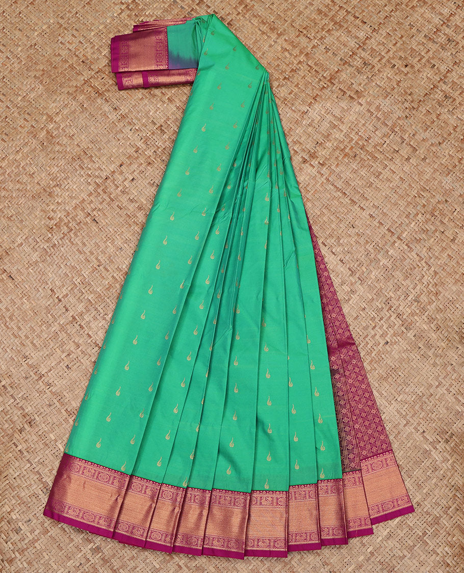 Green Budget Silk Saree, Sparsely Woven with Zari Buttas All Over Its Body, Complemented by a Contrast Traditional Zari Design Peacock-Chakram Border, Grand Pallu, and Paired with a Contrast Blouse