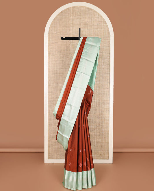 Rust zari buttas gift saree, contrast traditional zari design border, and zari striped pallu
