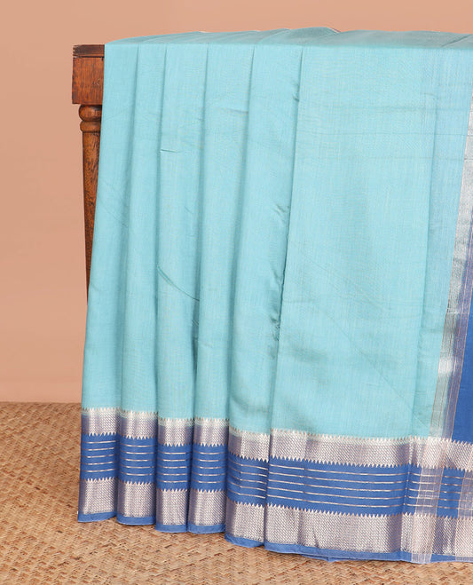 Blue plain assam silk saree, contrast traditional zari design border, and zari striped pallu