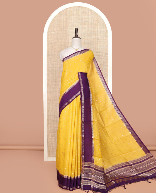 Yellow Assam Silk Saree Bedecked with Zari Buttas and Stripes, Complemented by a Contrast Traditional Zari  Design Border, a Captivating Pallu Featuring Zari Designs, and Paired with a Contrast Blouse