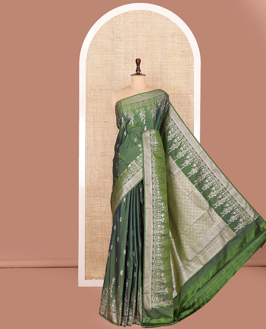 Green Budget Silk Saree, Richly Detailed with Floral Zari Buttas All Over Its Body, Highlighted by a Zari Border of Floral Designs, Grandly Woven Jaal Pallu, and Paired with a Matching Blouse