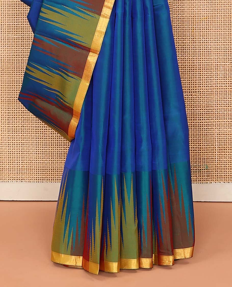 Blue plain Bangalore silk saree, contrast temple piping border, and zari-rich pallu of temple designs