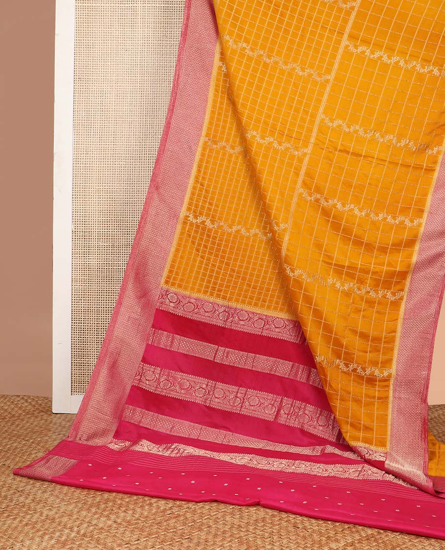 Orange checked fancy crepe saree with contrast checked border & floral design pallu
