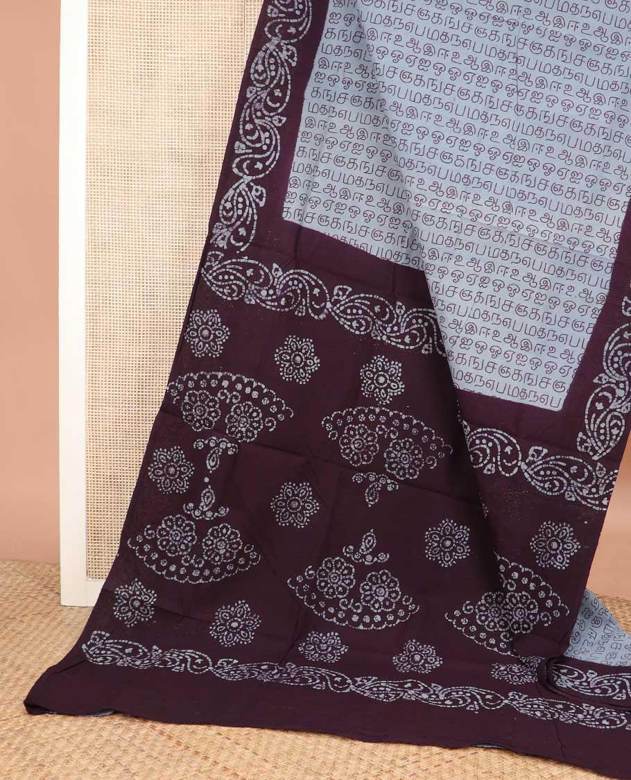 Grey Tamil letters printed sungudi cotton saree, contrast batik printed border, and batik printed pallu