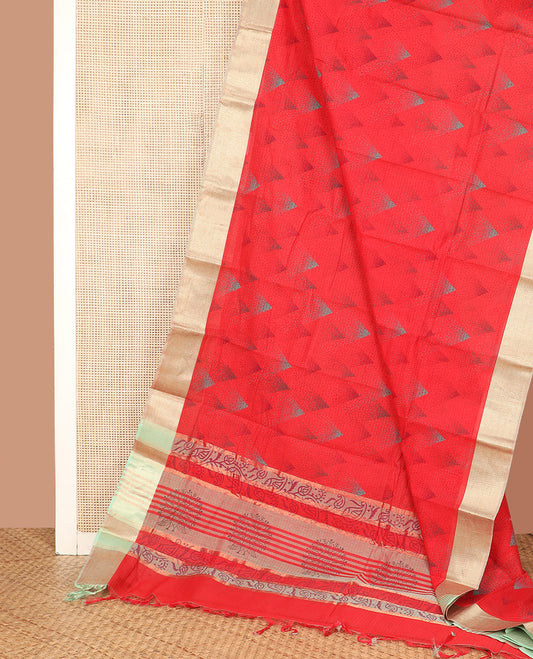 Red Chirala Cotton Saree, Subtly Sparkled with Triangle Printed All Over Its Body, Complemented by a Contrast Chevron Zari Border, Pallu Features Paisley and Peacock Block Print, and Paired with a Contrast Blouse