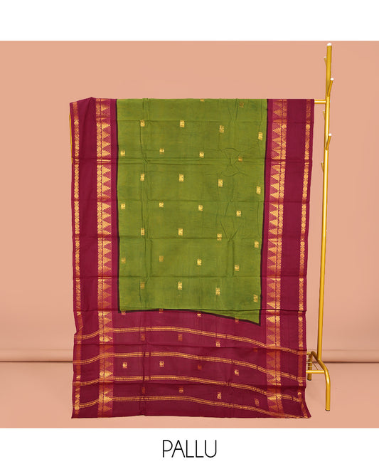 Parrot Green Sungudi Cotton Saree, Ornamented with Zari Buttas on Its Body, Complemented by a Contrast Retttai Pettu Traditional Zari Design Border, Zari-Design Pallu, and Paired with a Contrast Blouse
