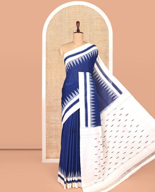 Navy Blue Plain Ikkat Cotton Saree, Complemented by a Contrast Ikkat Temple Border, Pallu Steeped with Buttas, and Paired with a Contrast Blouse