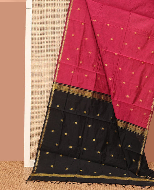 Red Maheshwari Cotton Saree, Highlighted by Flower Buttas All Over Its Body, Subtly Woven Piping Border, Captivating Contrast Pallu Steeped with Buttas, and Paired with a Contrast Blouse