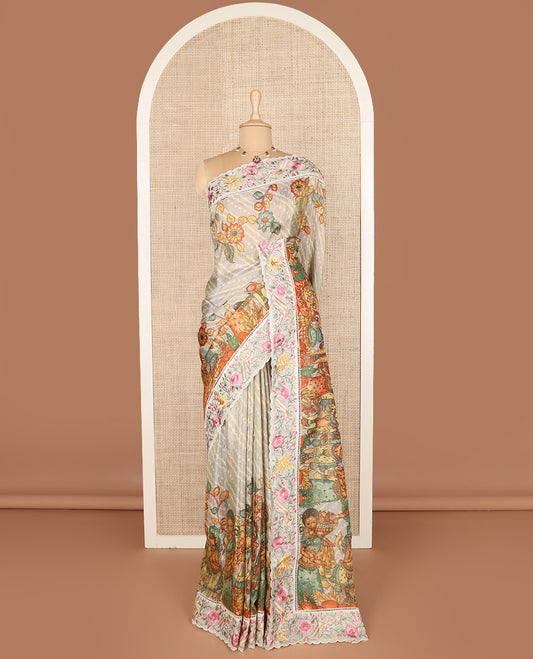 Grey buttas with bandhani and kalamkari floral-human motifs printed dola silk saree, contrast floral embroidered scallop border