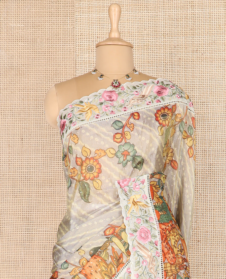 Grey buttas with bandhani and kalamkari floral-human motifs printed dola silk saree, contrast floral embroidered scallop border