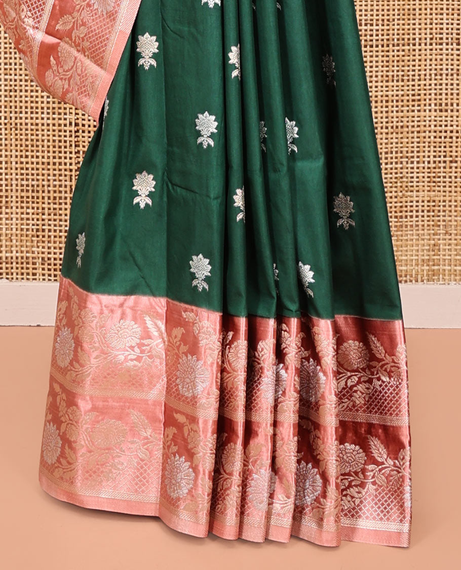 Bottle Green Mushuru Silk Saree, Enriched with Zari Buttas All Over Its Body, Complemented by Captivating Contrast Border of Floral Jaal Designs, Grandly Decked Up Pallu and Paired with a Contrast Blouse