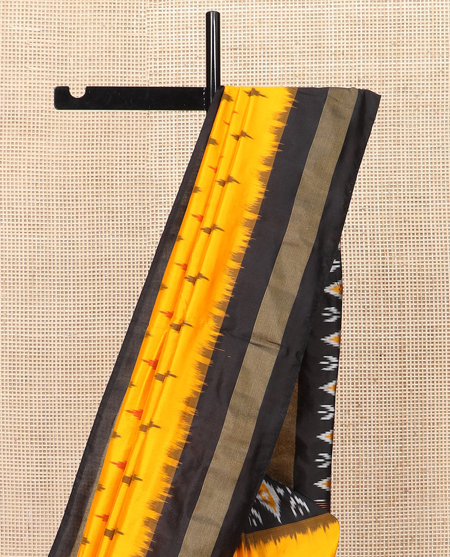 Yellow Ikkat Silk Saree Brightened with Ikkat Buttas, Complemented by a Contrast Ikkat Design Border, a Hazily Woven Pallu of Diamond Patterns, and a Contrast Blouse