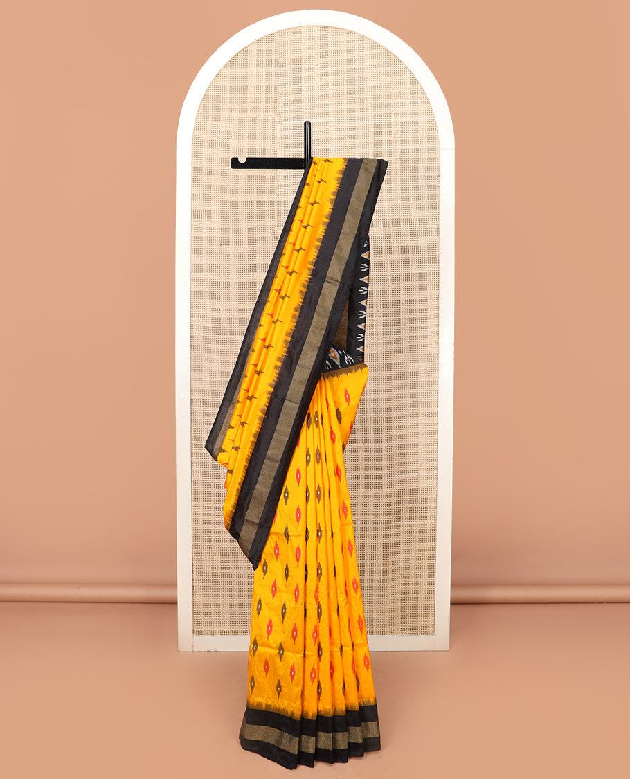 Yellow Ikkat Silk Saree Brightened with Ikkat Buttas, Complemented by a Contrast Ikkat Design Border, a Hazily Woven Pallu of Diamond Patterns, and a Contrast Blouse