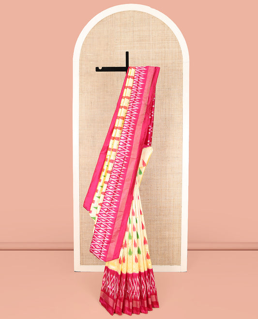 Sandal Ikkat Silk Saree, Beautifully Bedecked with Ikkat Temple Buttas All Over Its Body, Complemented by a Contrast Border of Jaal Designs, Pallu Steeped with Ikkat Buttas, and Paired with a Contrast Blouse