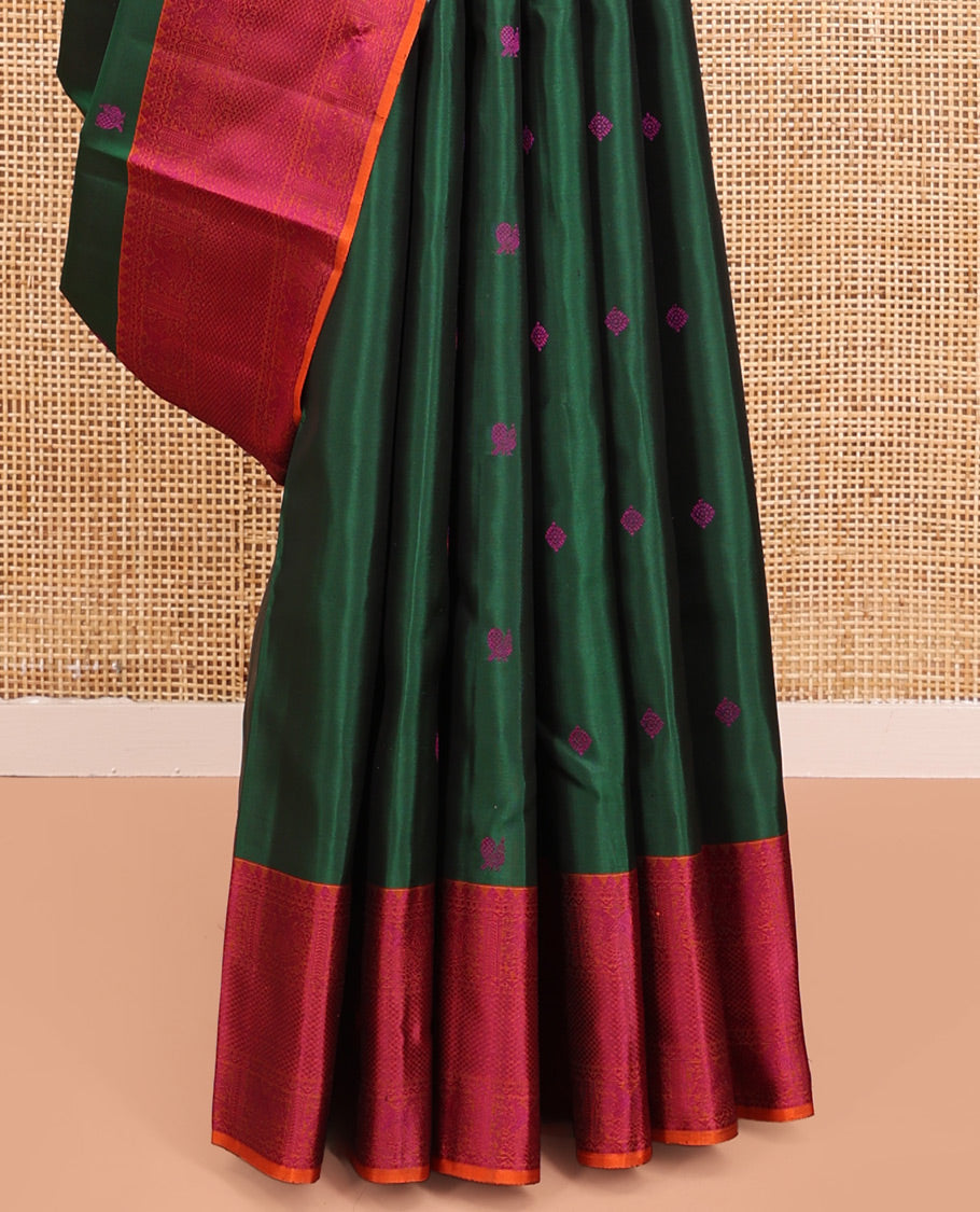 Green Kanchipuram Silk Saree, Accentuated with Thread Buttas All Over Its Body, Complemented by Contrast Border of Iruthalai Pakshi,  and Mayil Kann Designs, Jaal Pallu, and Paired with a Contrast Blouse