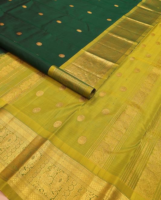 Green chakram zari buttas Kanchipuram silk saree, contrast border of rekku, muthu, mayil kann, and mayil designs, and mayil chakram motifs featured pallu