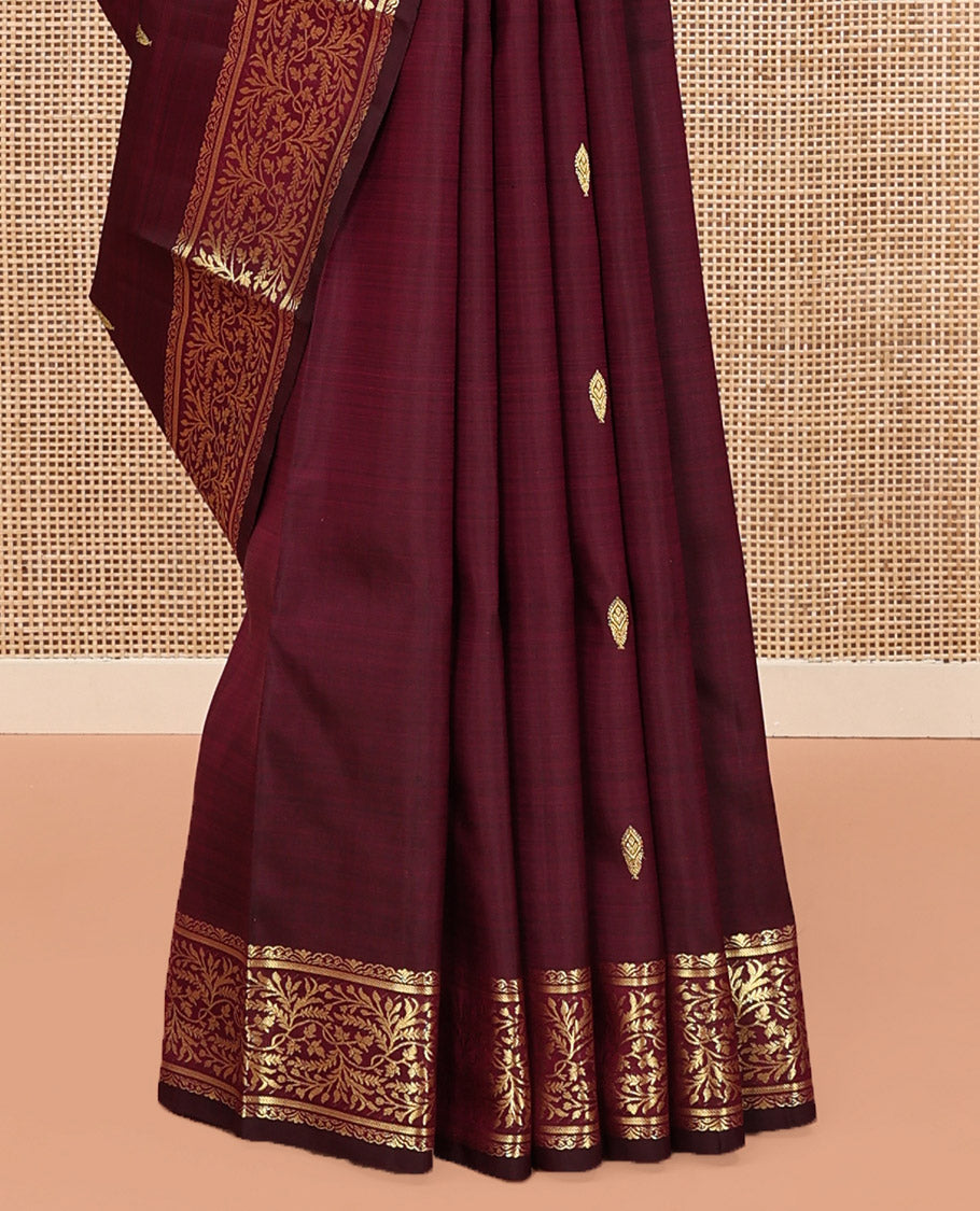 Wine Kanchipuram Silk Saree, Embellished with Zari Buttas on Its Body, Highlighted by a Zari Border of Floral Designs, Pallu of Jaal Designs, and Paired with a Matching Blouse