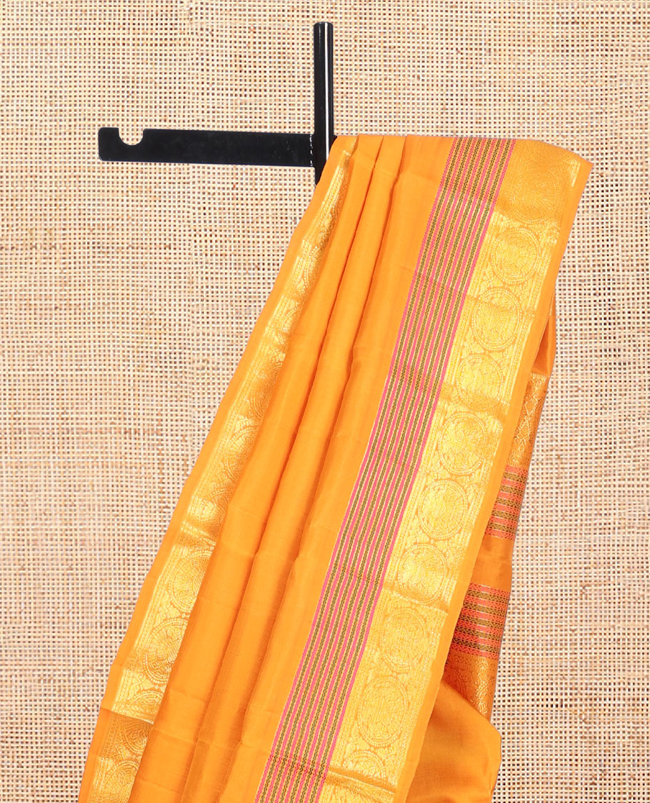 Yellow Plain Kanchipuram Silk Saree, Highlighted by Self-Border of Neli, Muthu, and Iru Thalai Pakshi Designs, a Self-Pallu, and Matching Blouse