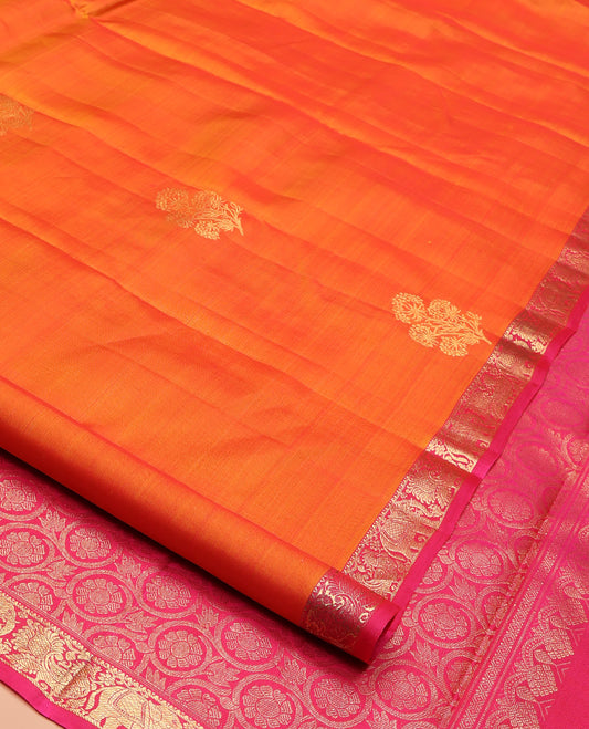 Orange Kanchipuram Silk Saree, Accentuated with Zari Buttas All Over Its Body, Complemented by Contrast Border of Yaanai and Mayil Designs, Grand Floral Jaal Pallu, and Paired with a Contrast Blouse