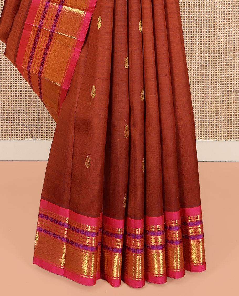 Brown Kanchipuram Silk Saree, Woven with Zari Buttas on Its Body, Complemented by a Contrast One-Sided Border of Panner Sombu, Banaras, Rudraksham, and Mayil Kann Designs, Pallu of Zari Designs, and Comes Without a Blouse
